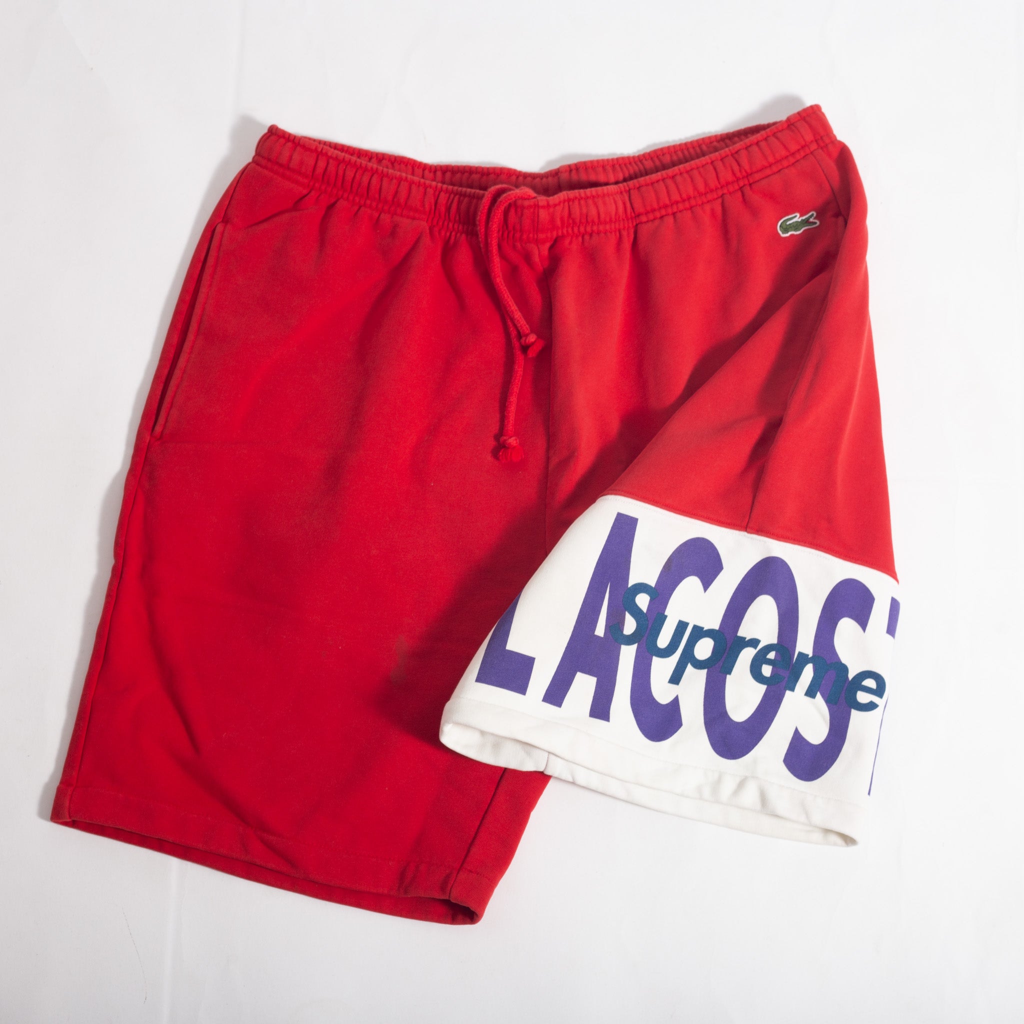 Bermuda Lacoste x Supreme Vermelha (VNDS)